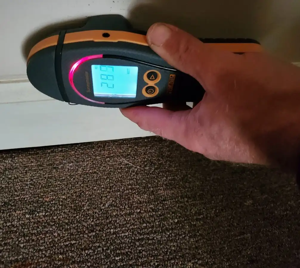 Moisture detection at baseboard during Storm Damage Restoration in Ephraim